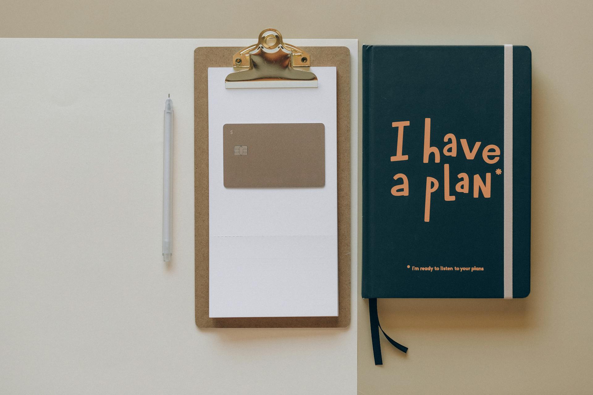 Notebook and clipboard symbolizing strategic planning and digital transformation for business efficiency.