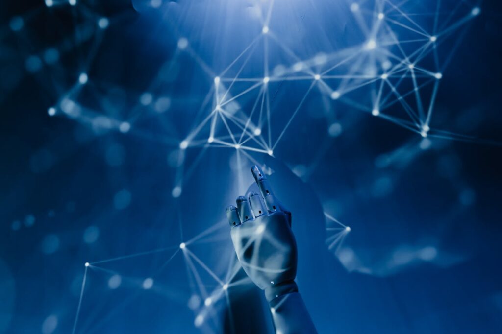 Robotic hand pointing at interconnected neural networks, symbolizing the importance of private and secure AI models for businesses in 2025.
